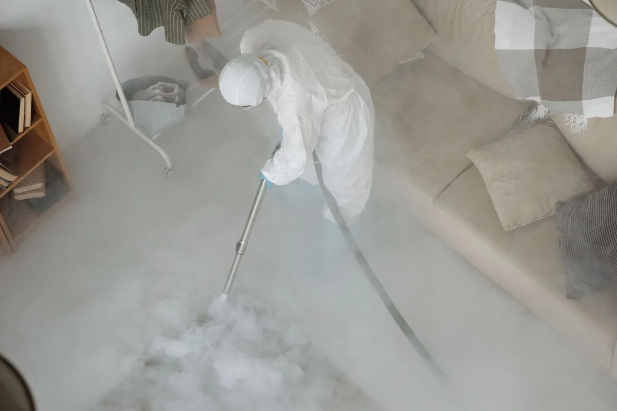 Biohazard cleanup technician in protective equipment, Alta, IA